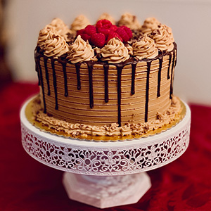 A cream colored icing celebration cake