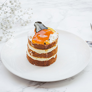 three layered spongecake pudding with white cream in between